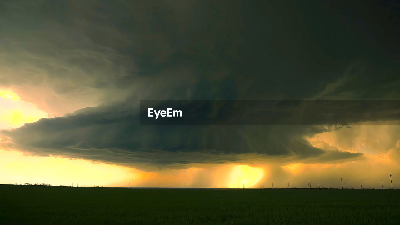 cloud, sky, environment, beauty in nature, landscape, storm, nature, dramatic sky, scenics - nature, thunderstorm, no people, land, field, sunset, sunlight, tranquility, storm cloud, rural scene, power in nature, outdoors, tranquil scene, plant, green