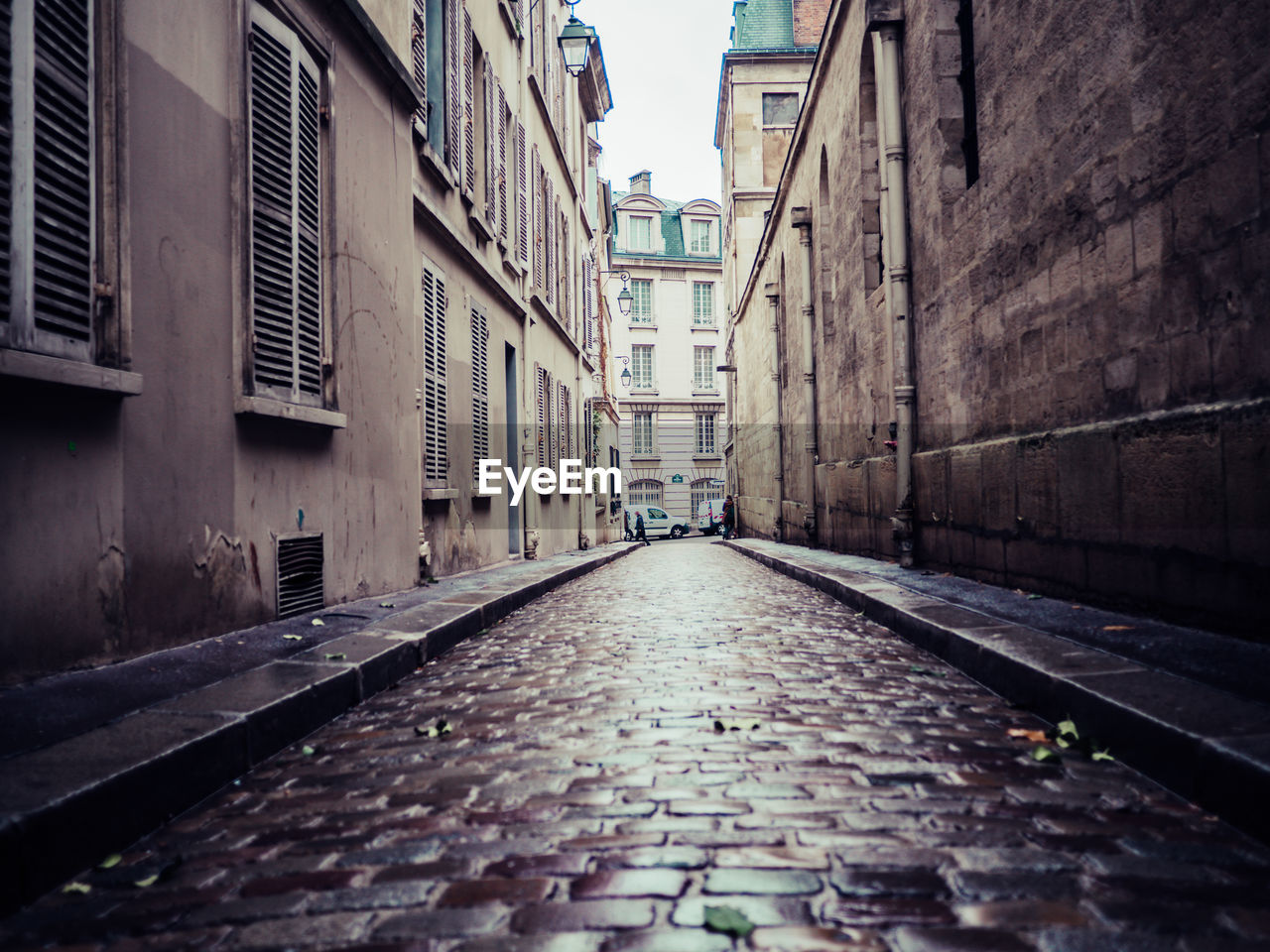 SURFACE LEVEL OF NARROW ALLEY AMIDST HOUSES