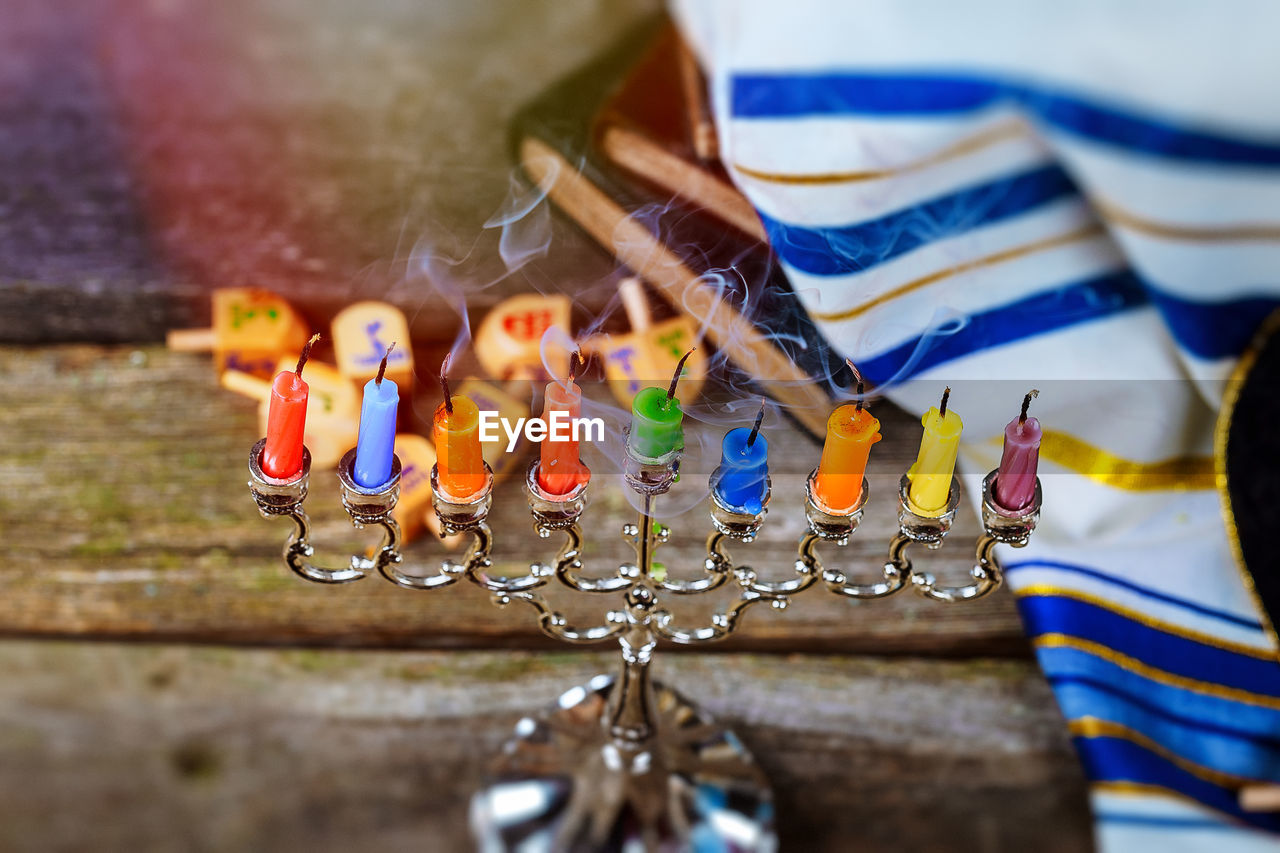 Close-up of colorful candles on table during hanukkah