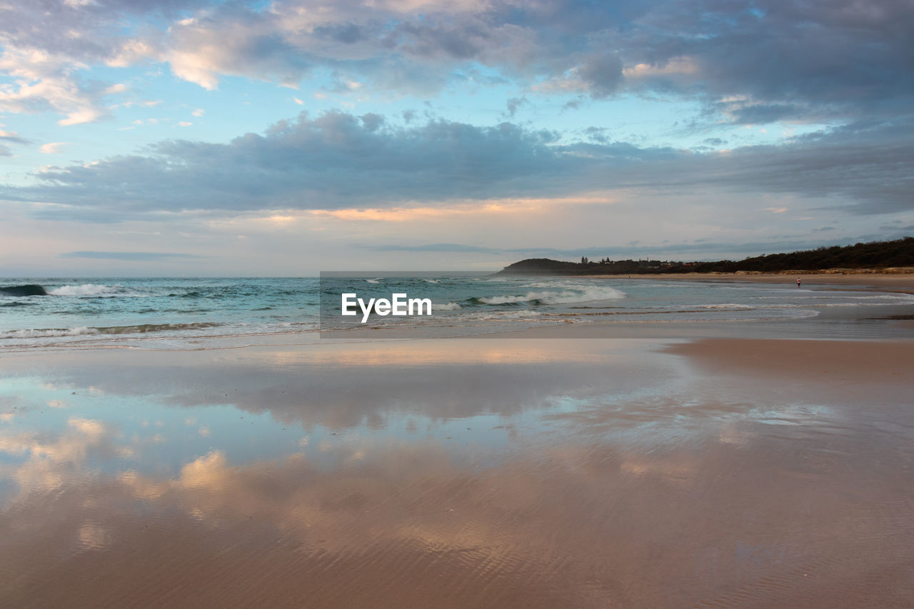 Scenic view of beach against sky during sunset