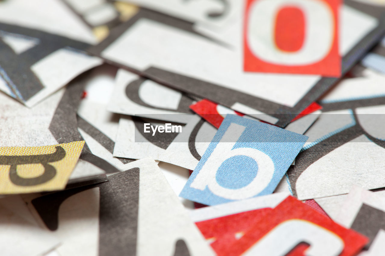 Full frame shot of alphabets on papers