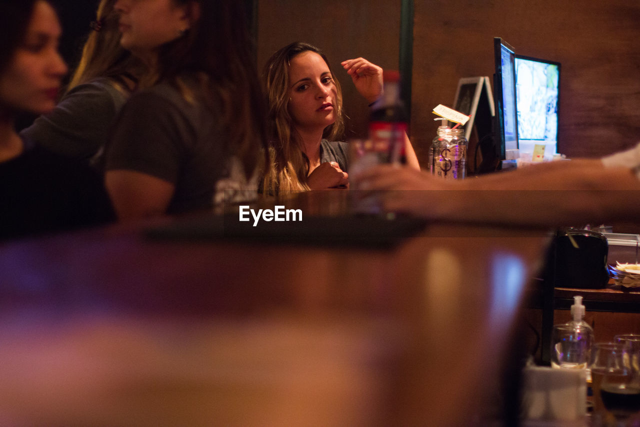 People sitting in restaurant at bar counter