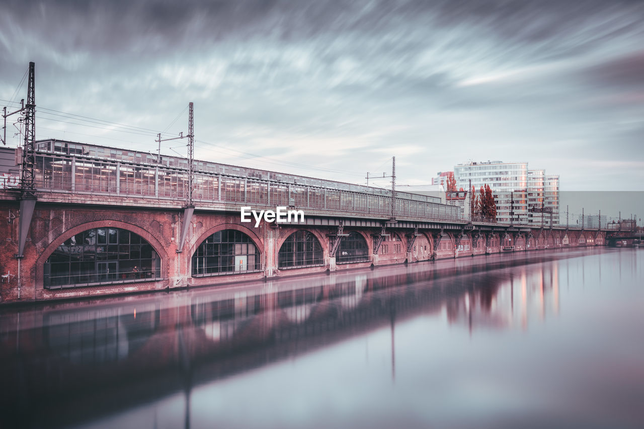 Bridge over the river against clouds