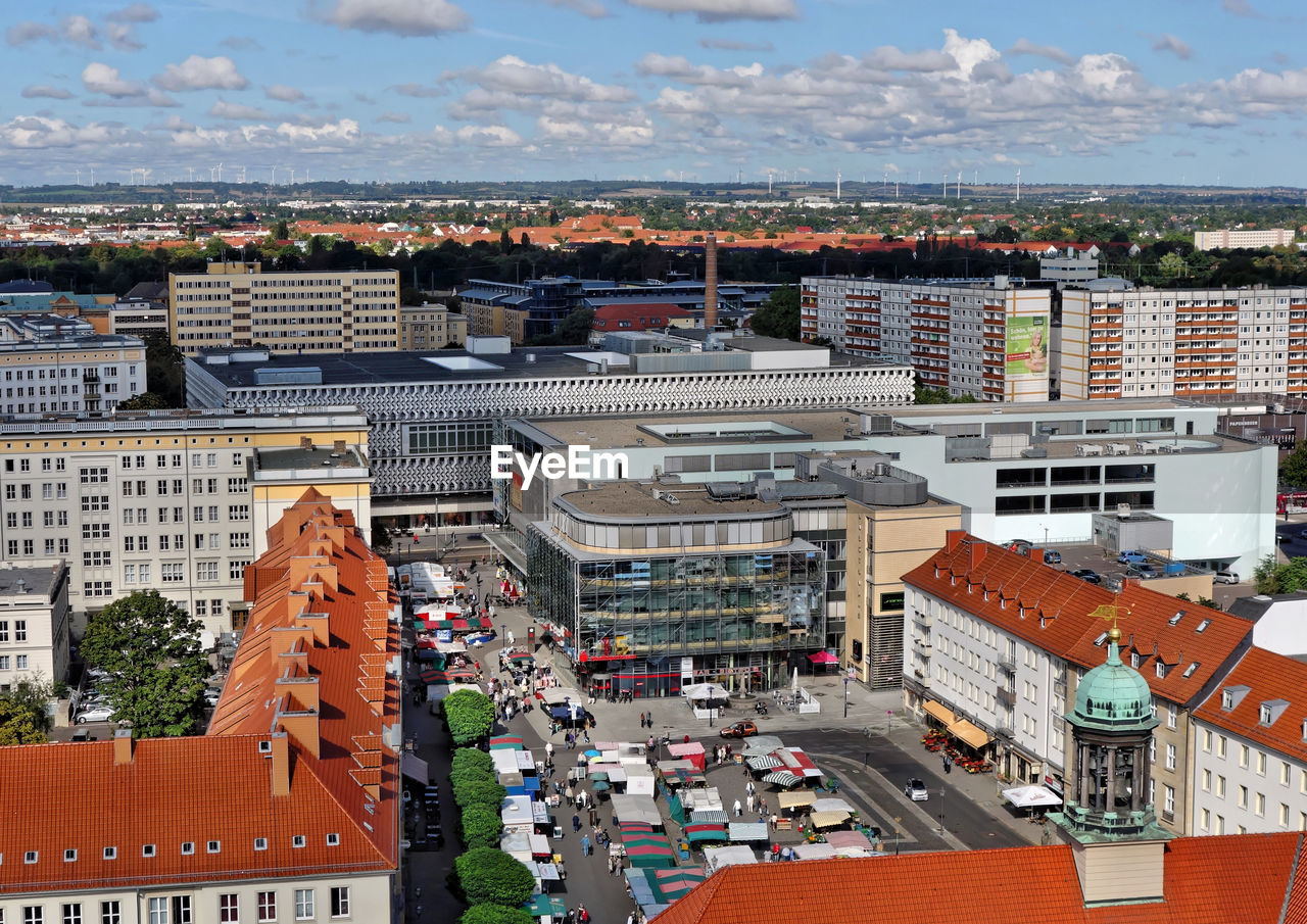 High angle view of buildings in city against sky