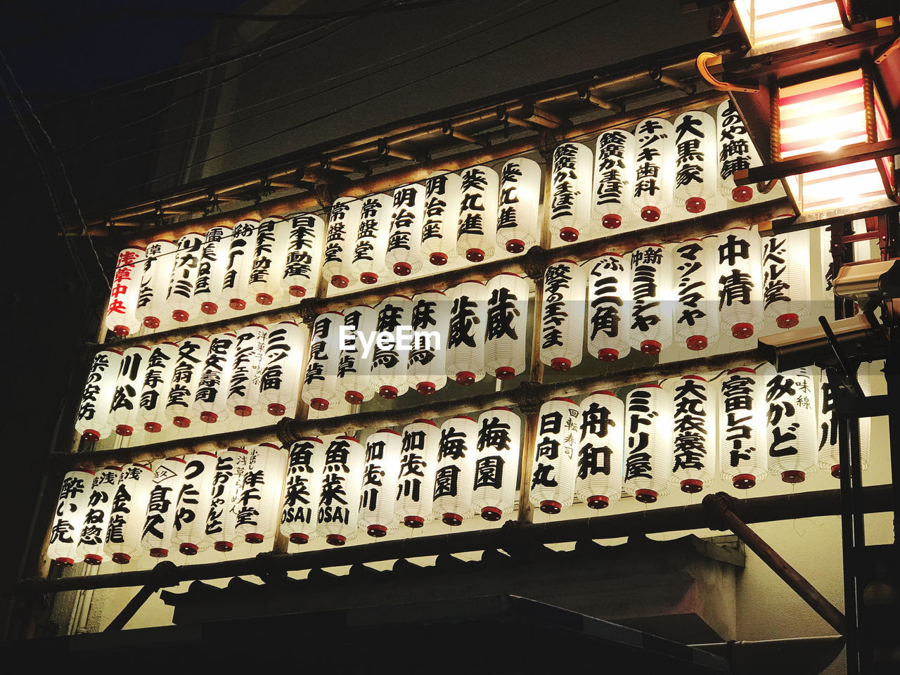 LOW ANGLE VIEW OF TEXT ON BUILDING