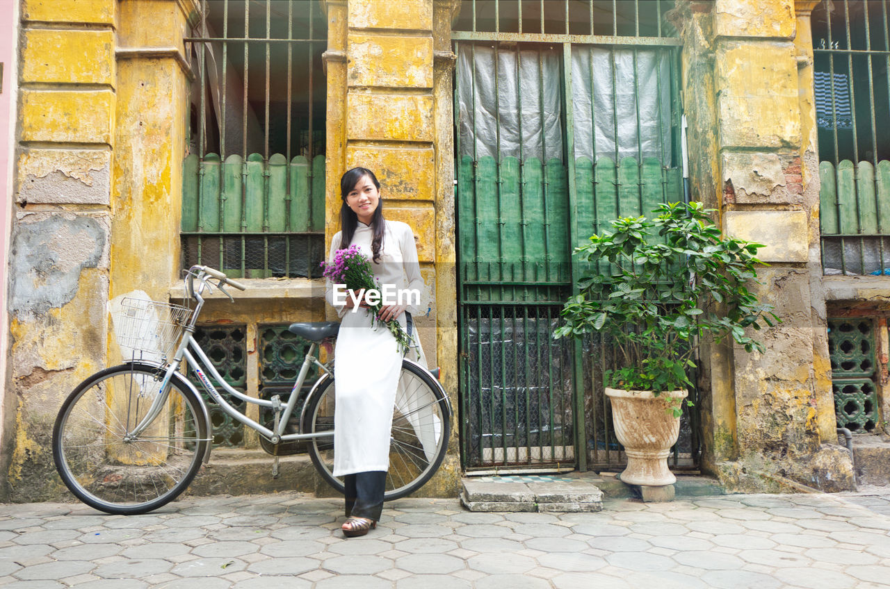 Young vietnamese girl wearing ao dai dress.