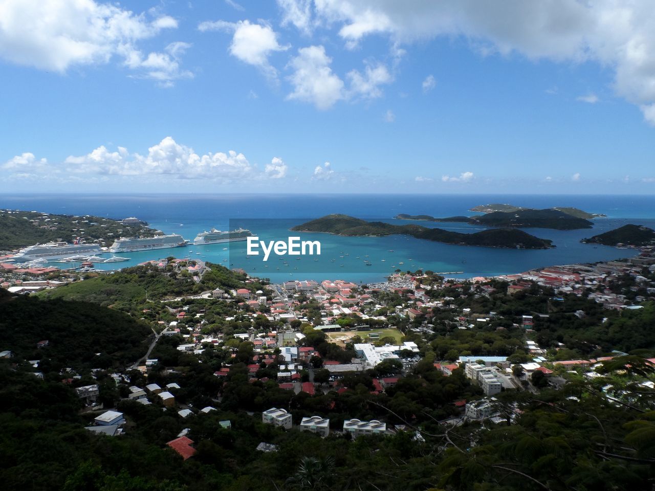 High angle view of buildings by sea