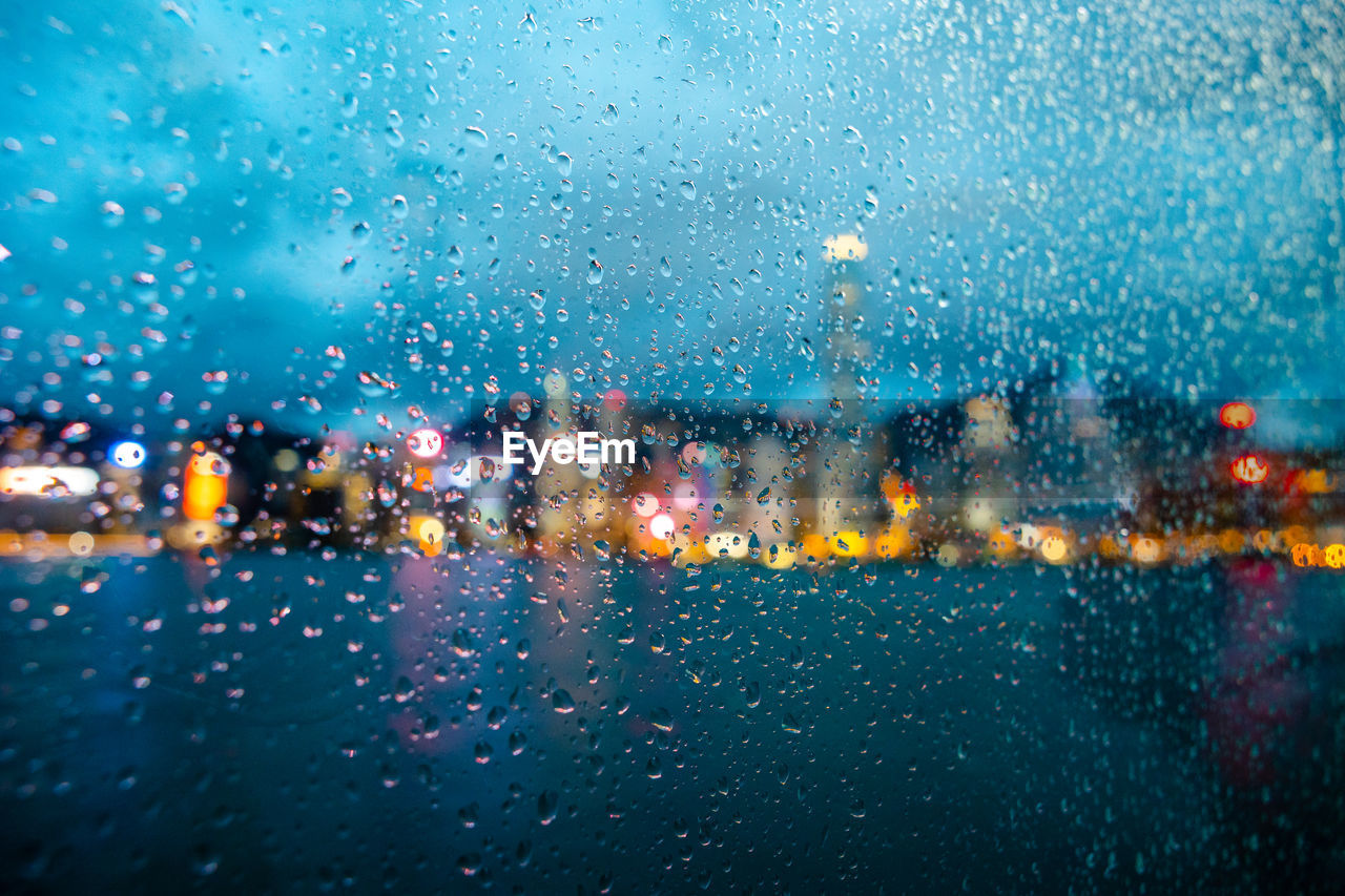 Wet glass window in rainy season