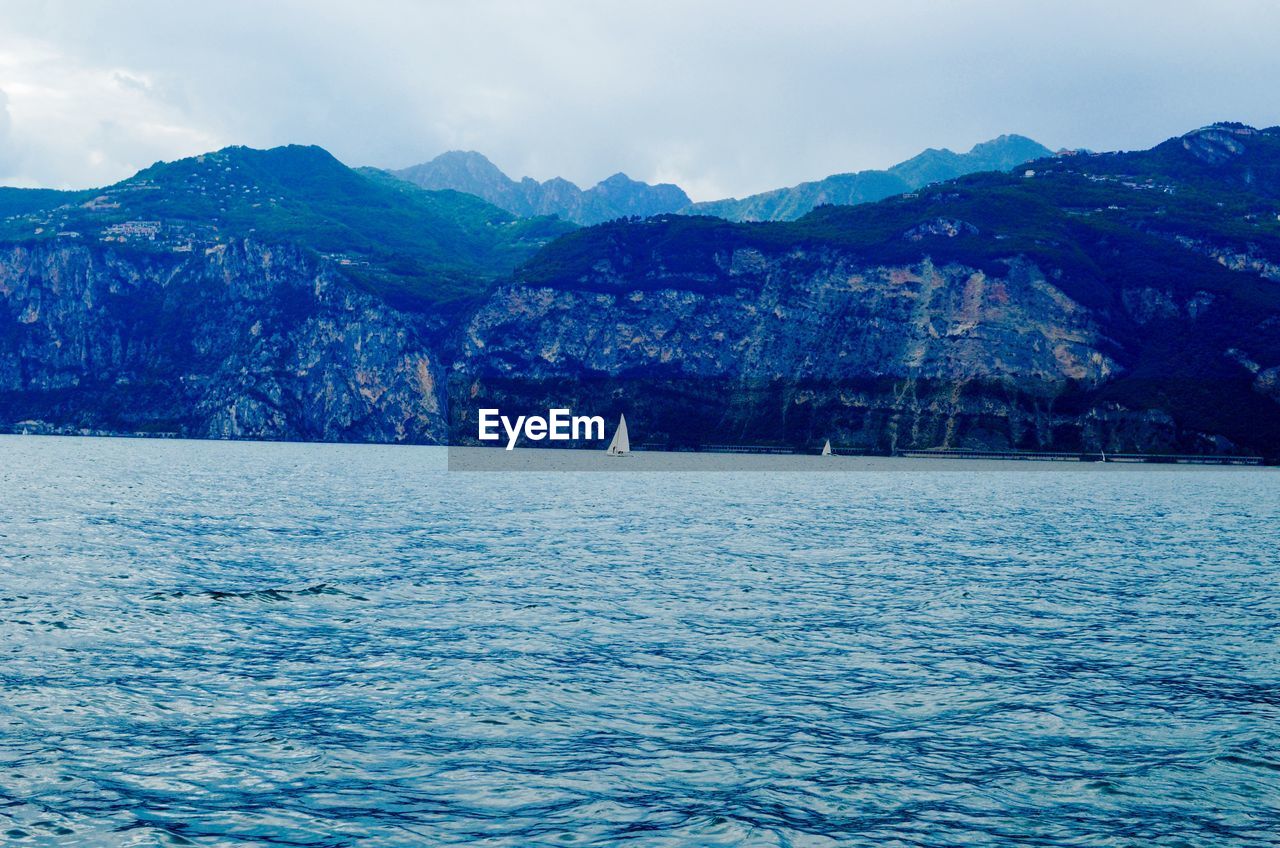 Scenic view of mountains by lake