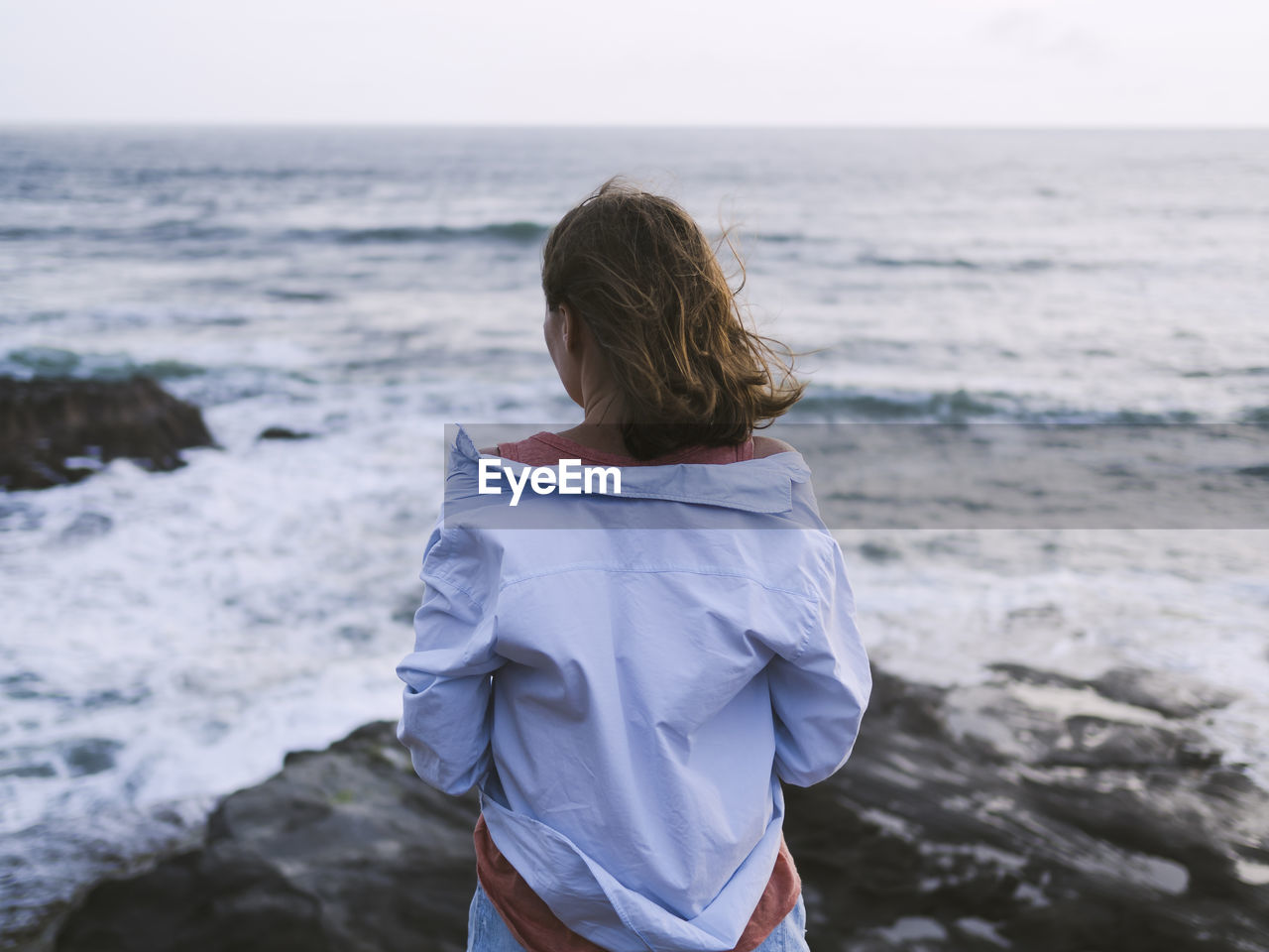 Young woman looking at ocean