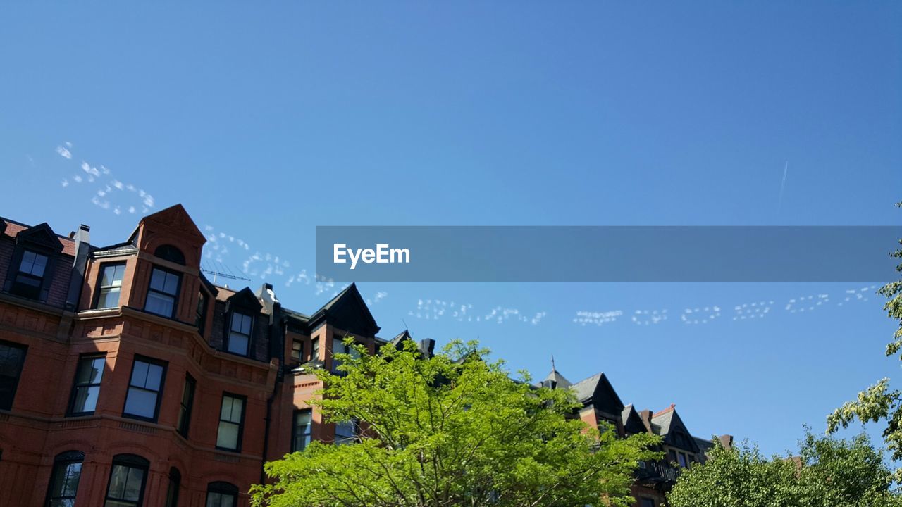 BUILT STRUCTURE AGAINST BLUE SKY