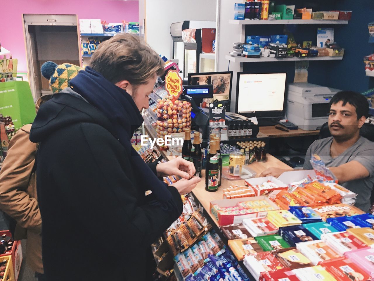 YOUNG WOMAN AT MARKET