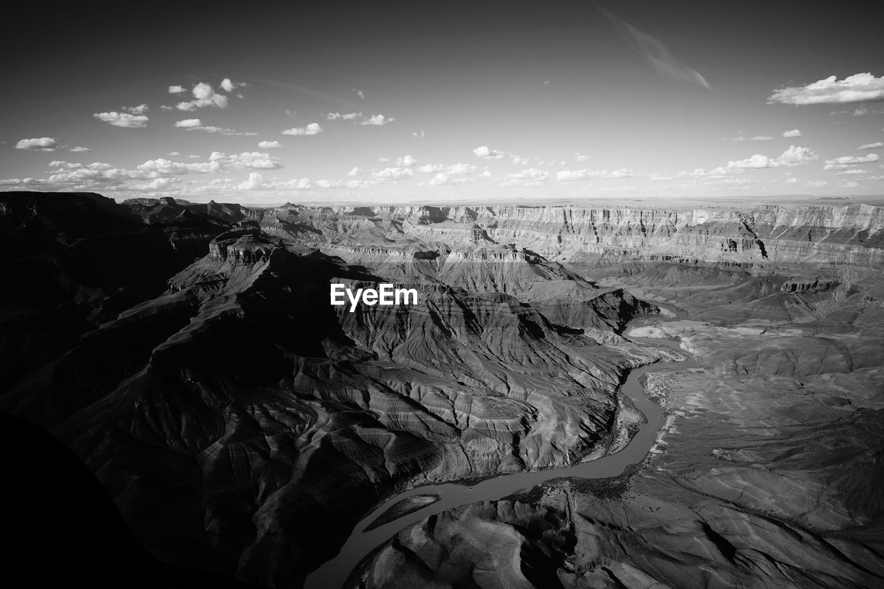 Scenic view of rock formations in desert against sky