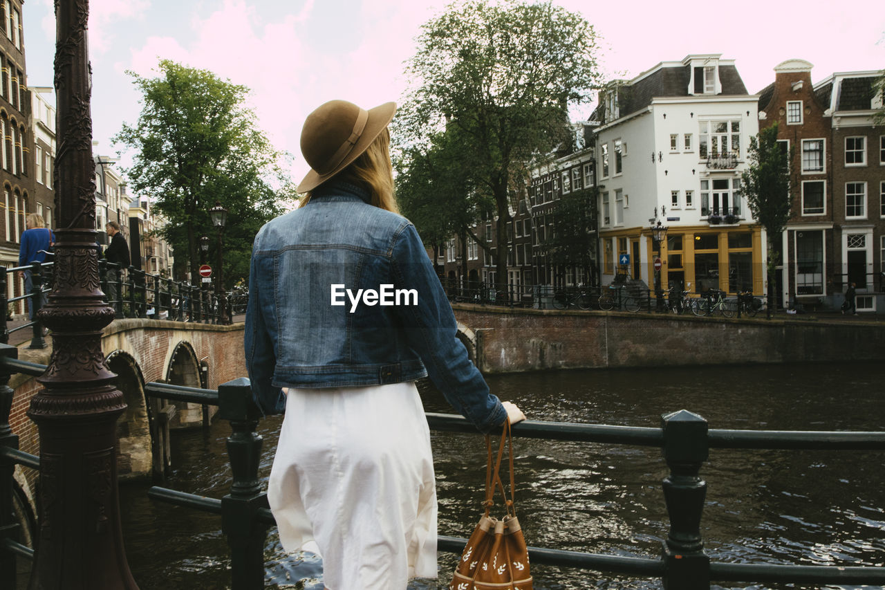 Woman overlooking canal and city