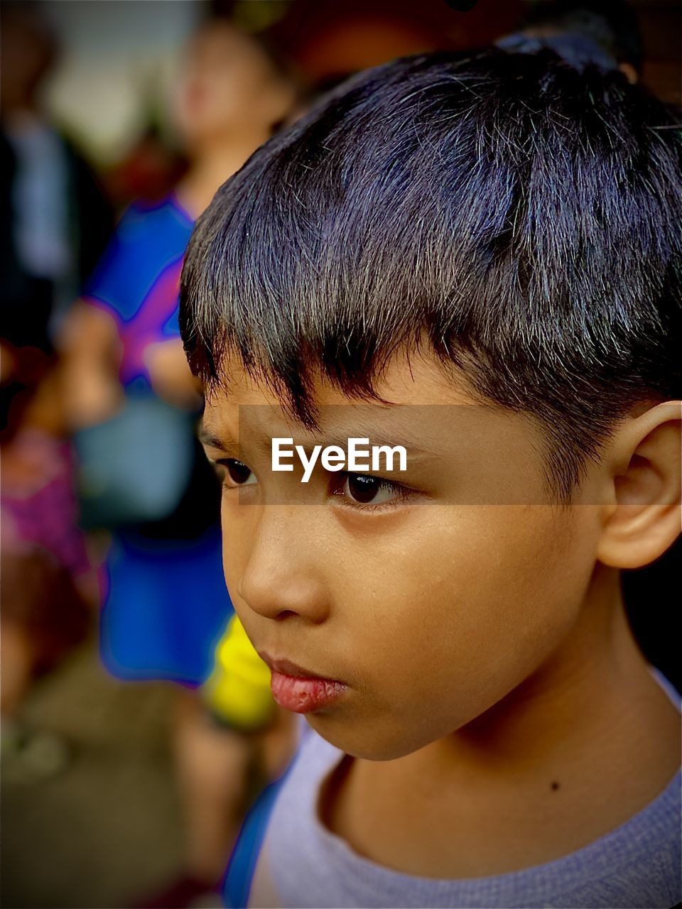 Close-up of boy looking away