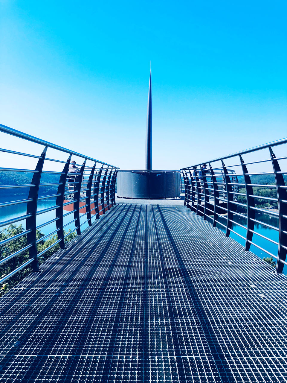 BRIDGE OVER SWIMMING POOL AGAINST SKY