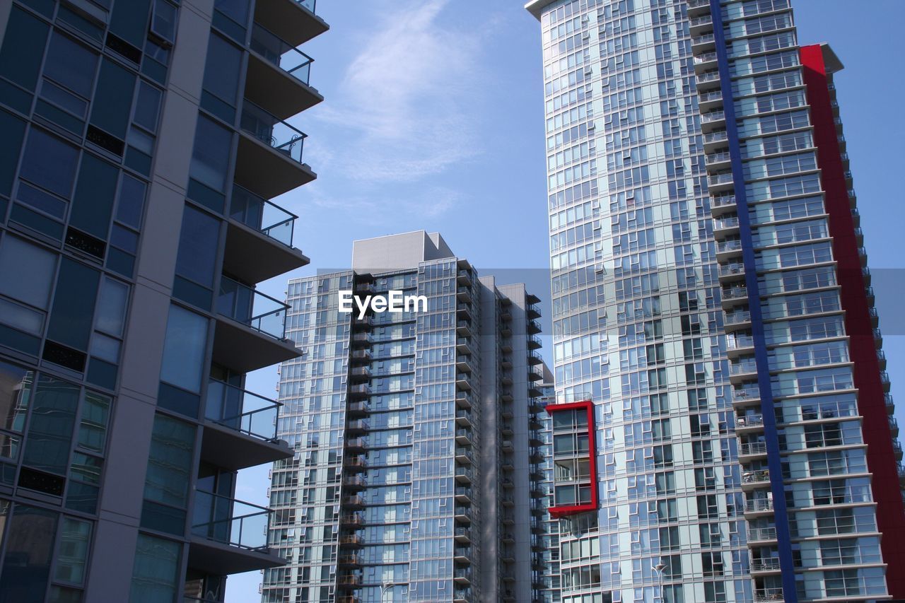 LOW ANGLE VIEW OF MODERN BUILDINGS AGAINST SKY