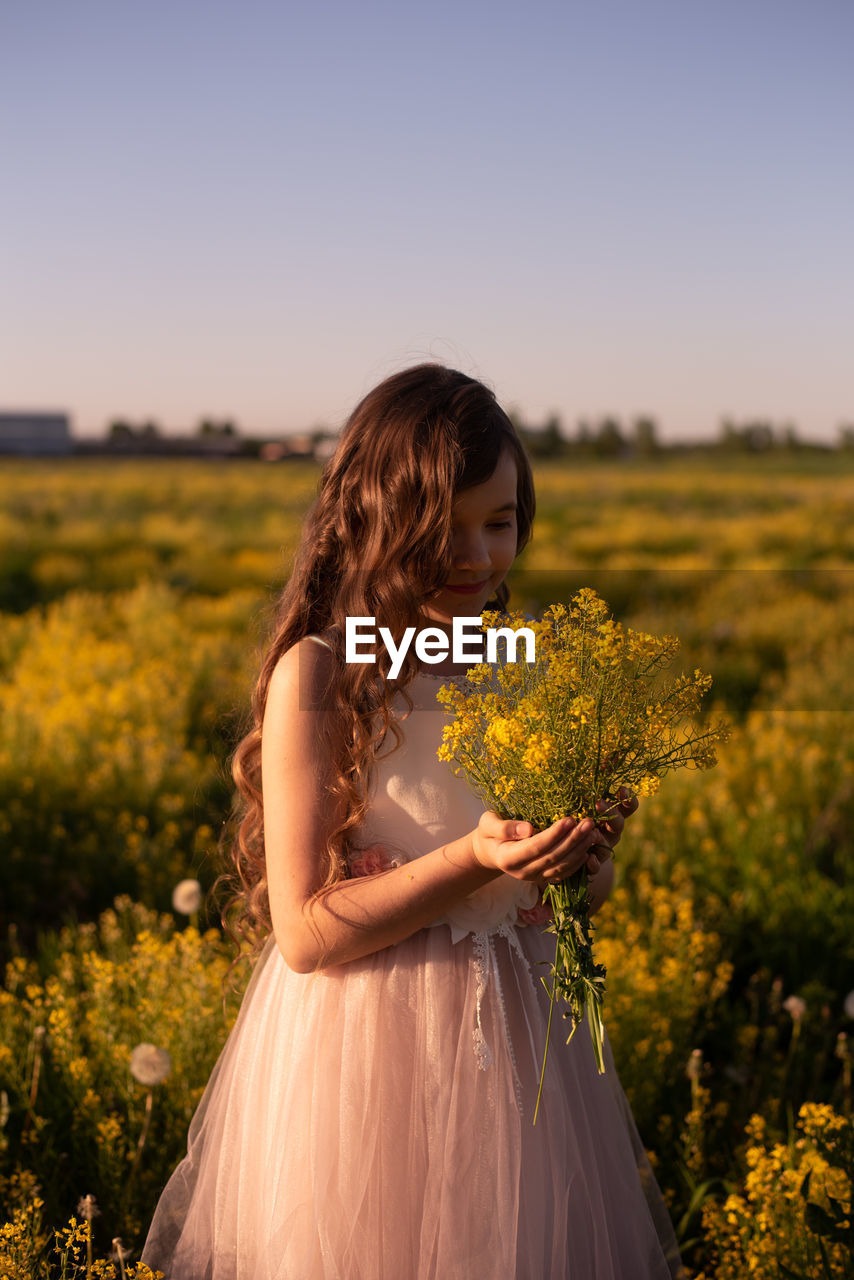 Girl standing on field