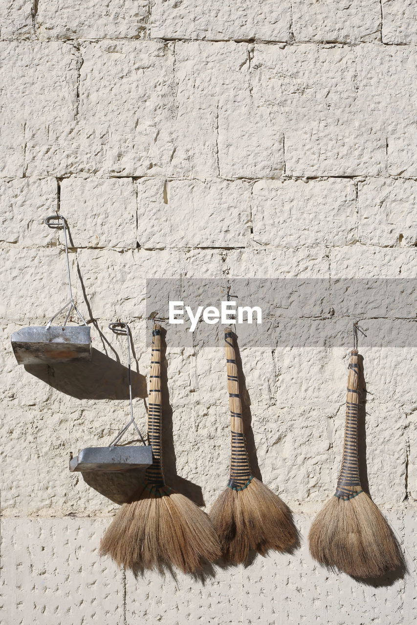 CLOSE-UP OF CLOTHES HANGING ON WOOD