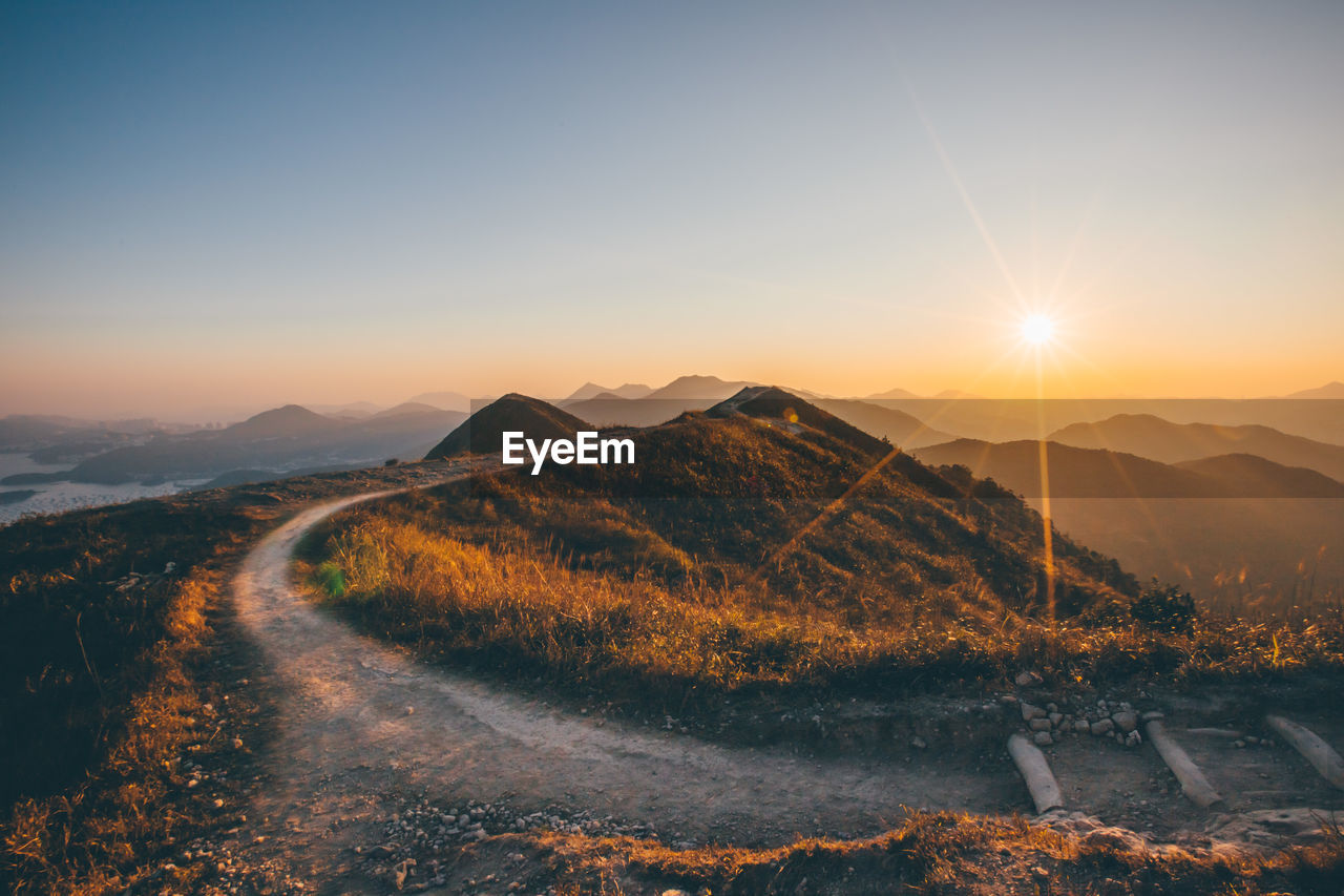 Scenic view of mountains against sky during sunset