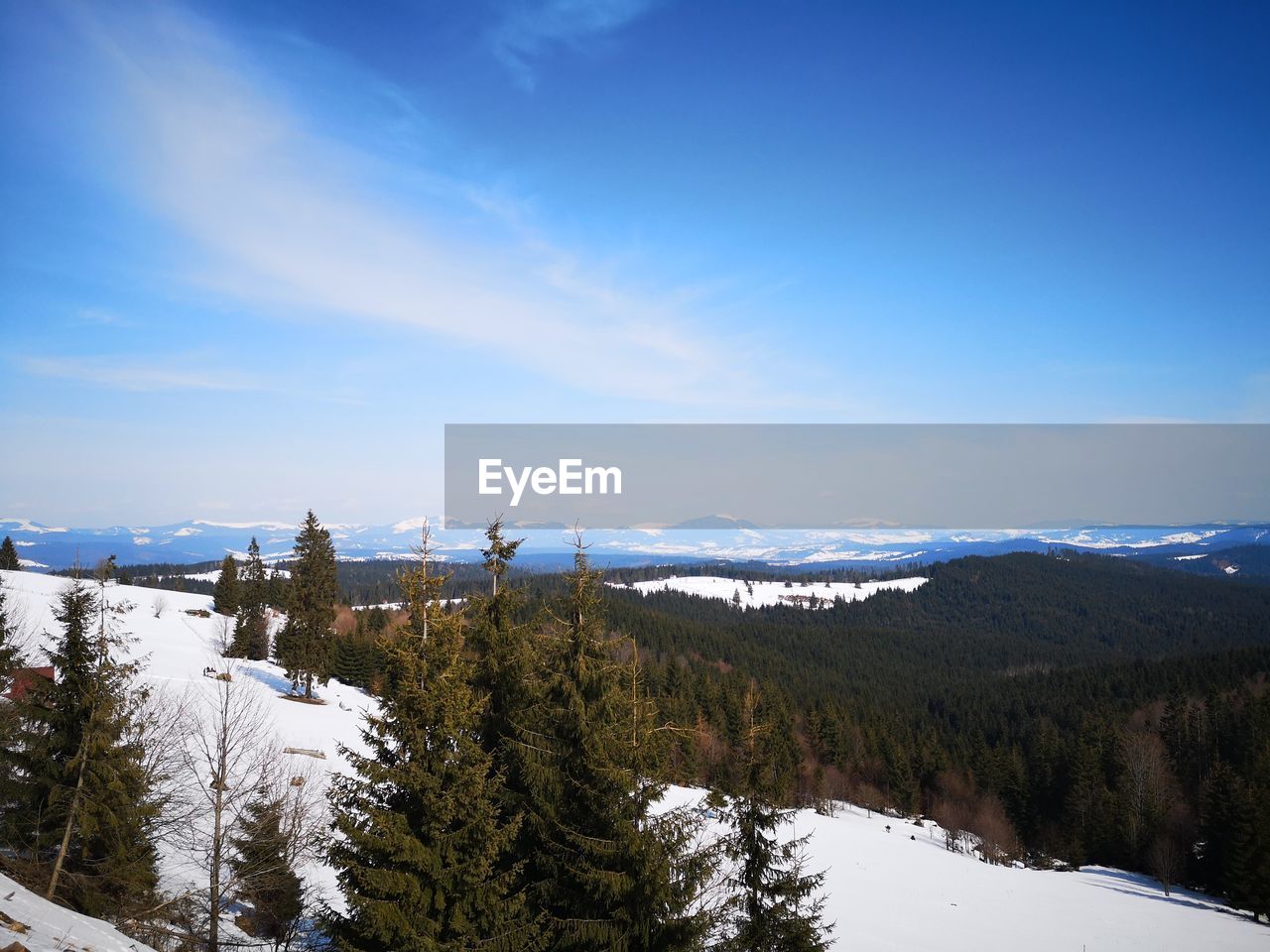 SCENIC VIEW OF MOUNTAINS AGAINST SKY DURING WINTER
