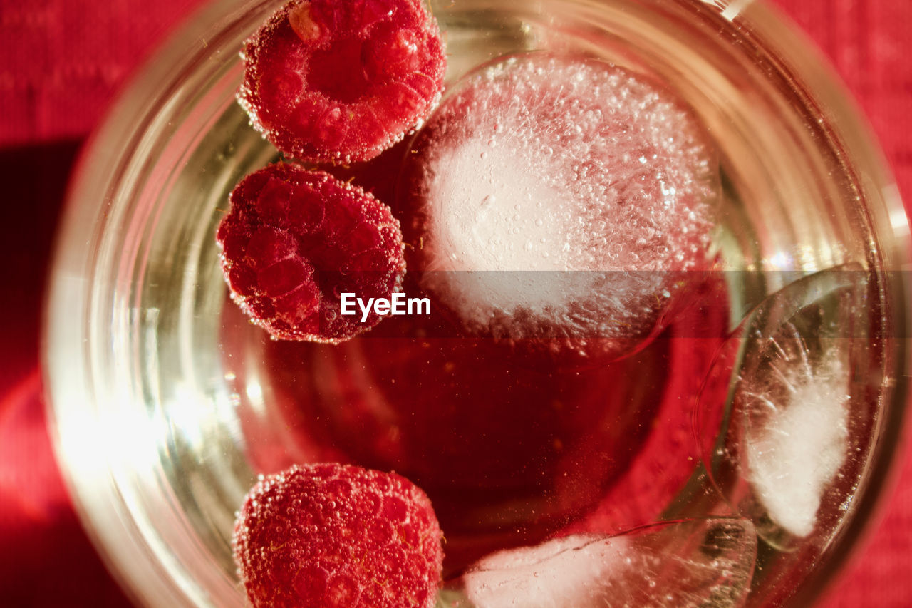 CLOSE-UP OF STRAWBERRY IN GLASS