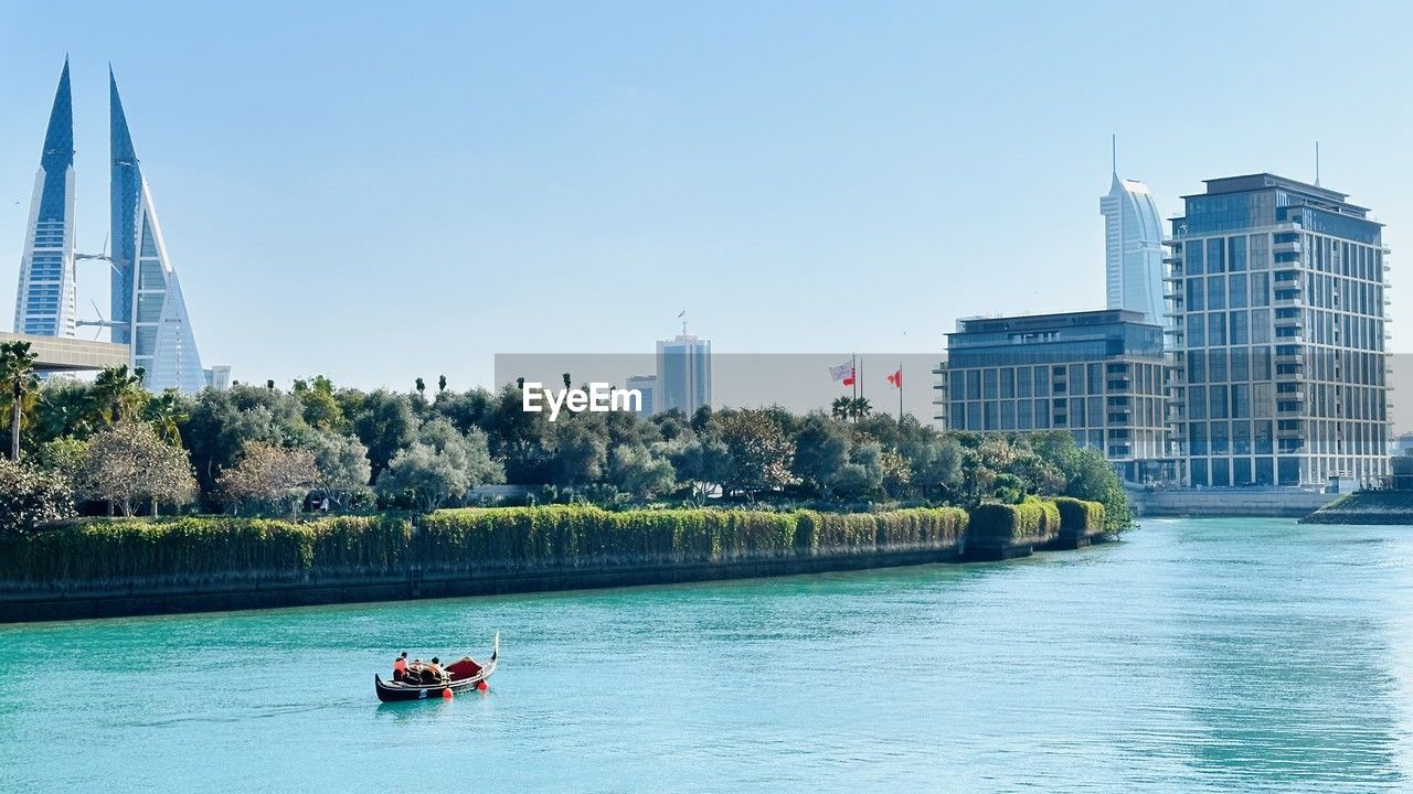 view of buildings in sea against clear sky