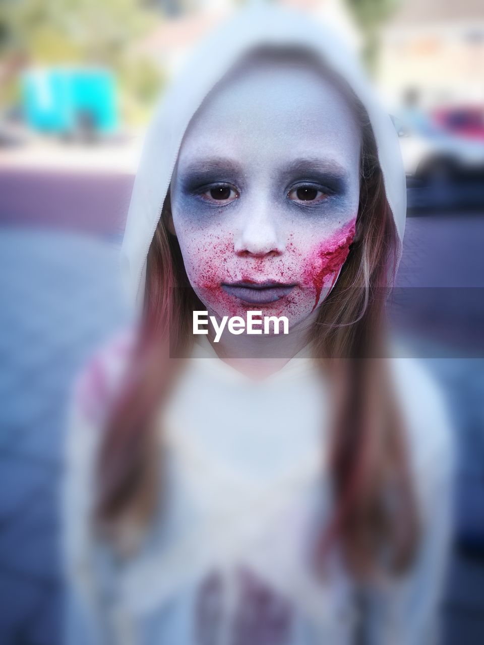 Close-up portrait of girl with face paint