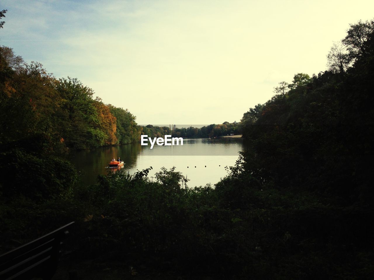 Lake and trees against sky