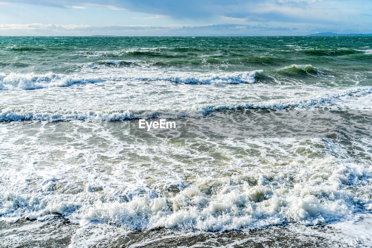 sea, wind wave, water, wave, shore, motion, ocean, land, beauty in nature, water sports, surfing, sports, beach, coast, scenics - nature, body of water, sky, nature, environment, cloud, outdoors, power in nature, horizon, day, horizon over water, wind, splashing, landscape, travel destinations, idyllic, travel, seascape, rock, blue, tranquility