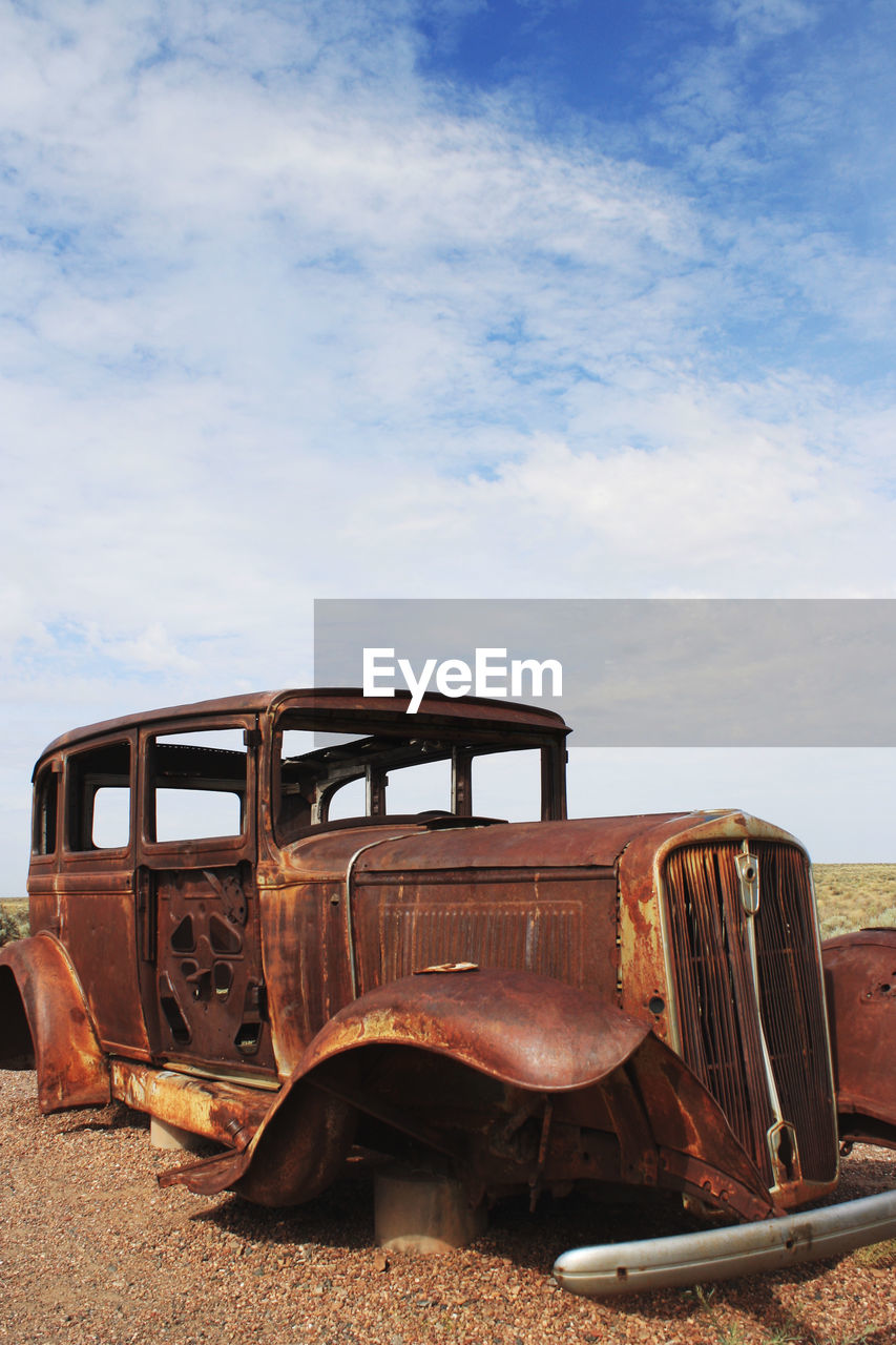 OLD ABANDONED TRUCK ON FIELD