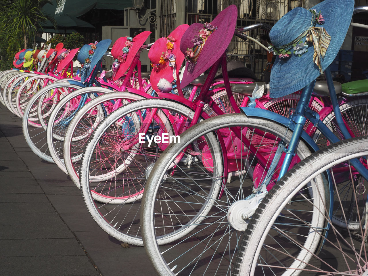 HIGH ANGLE VIEW OF BICYCLES PARKED IN BASKET