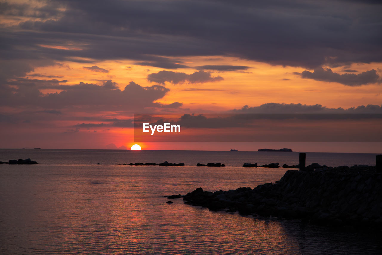 Scenic view of sea against sky during sunset