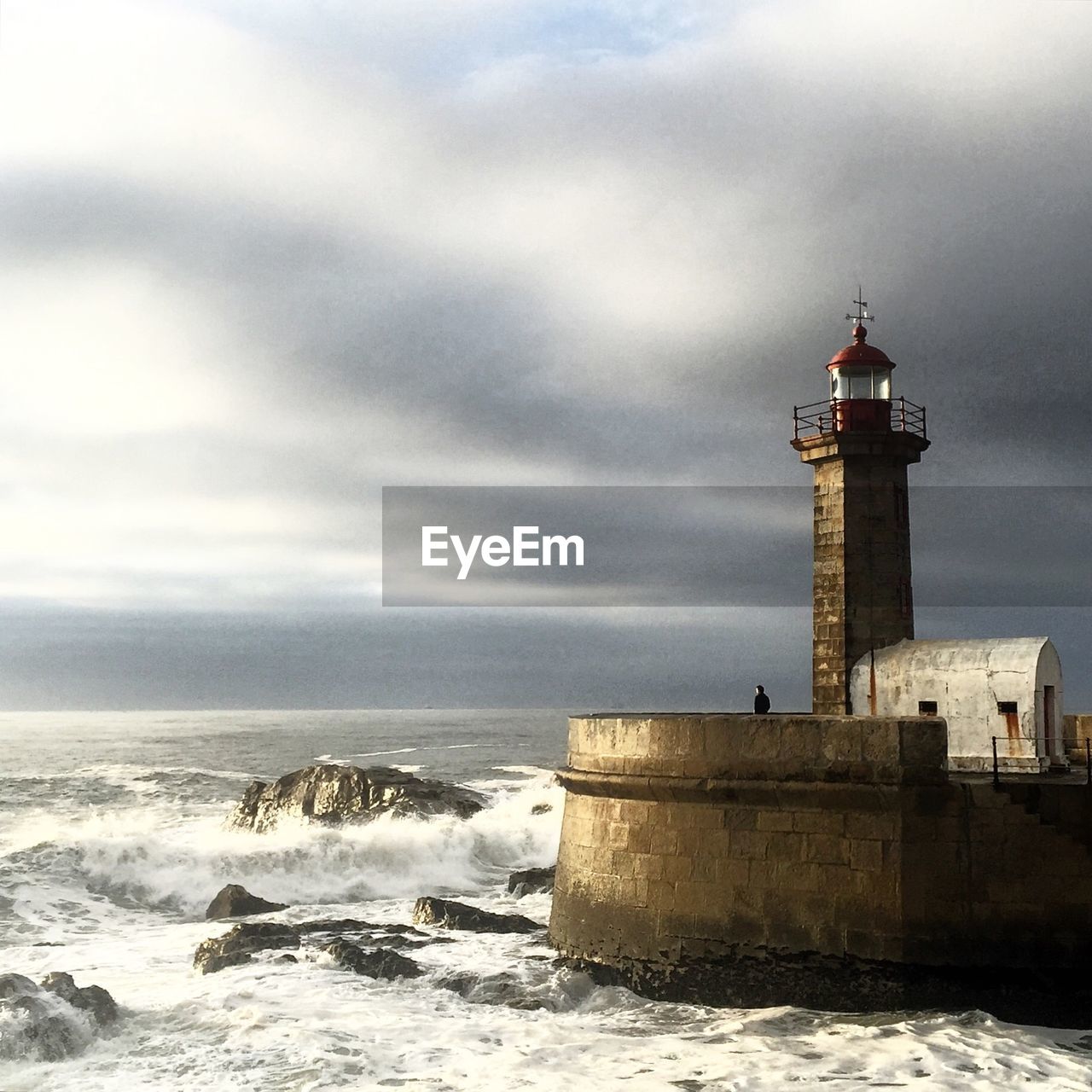 Scenic view of sea against cloudy sky