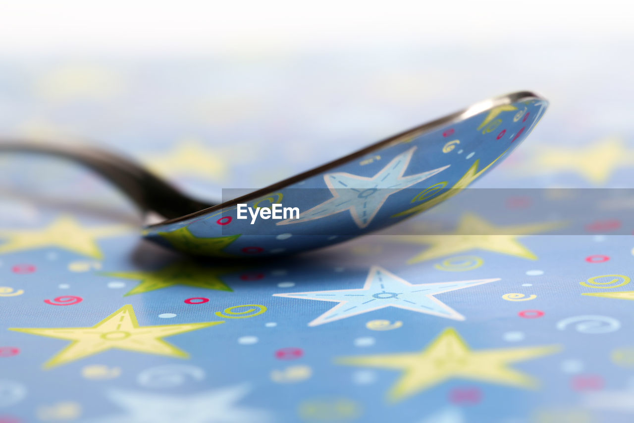 Spoon on colorful table