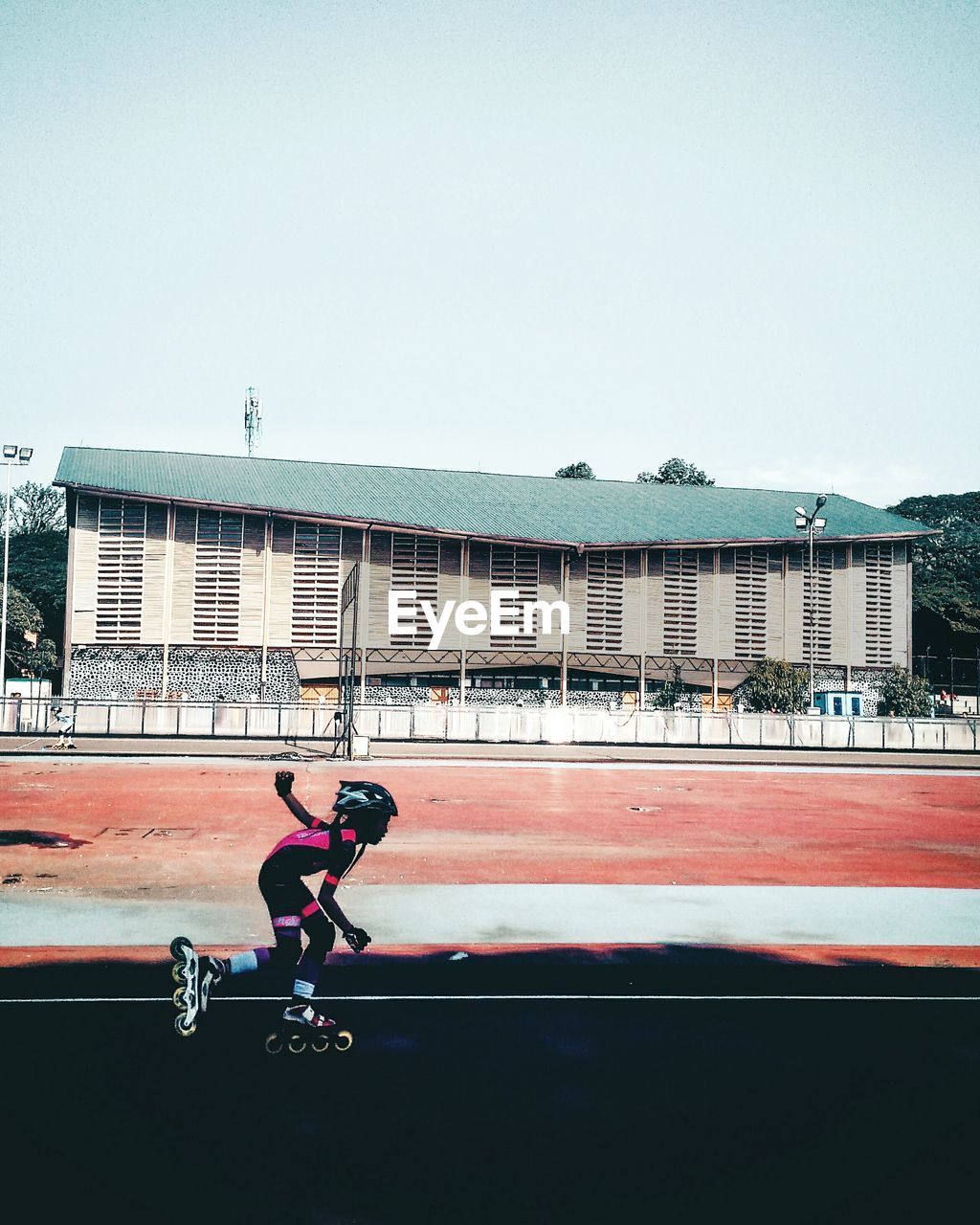 MAN RIDING BICYCLE IN CITY