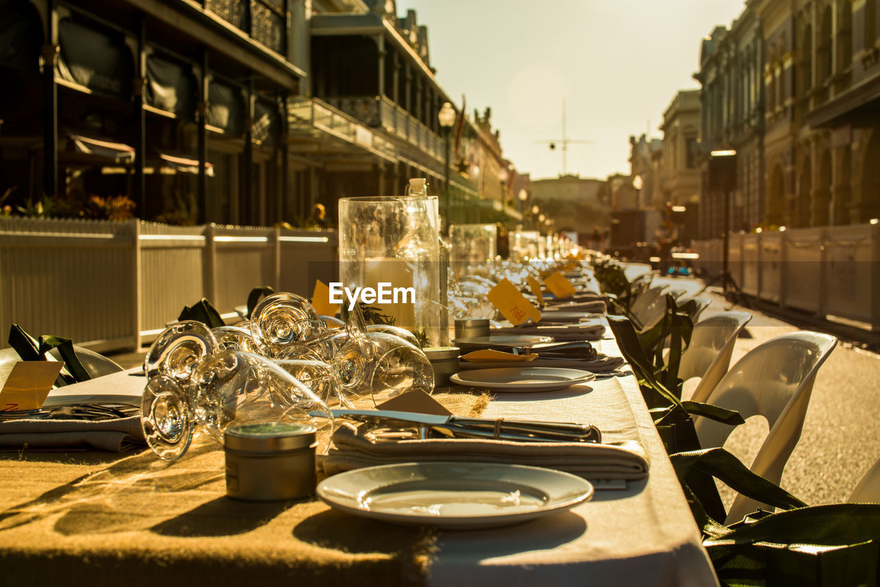 VIEW OF RESTAURANT AND WINE GLASS ON TABLE AT CAFE