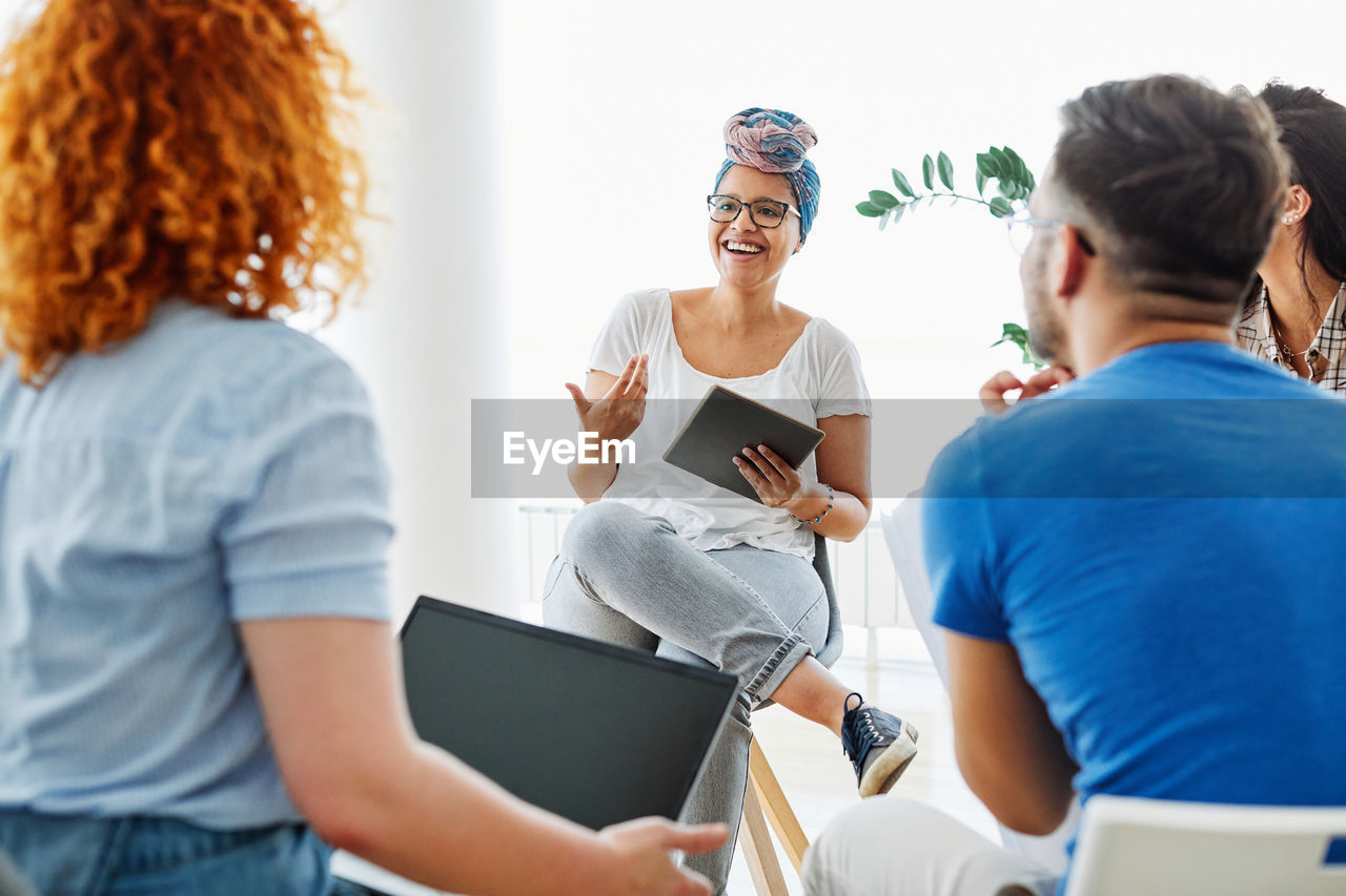 Group of people discussing at office