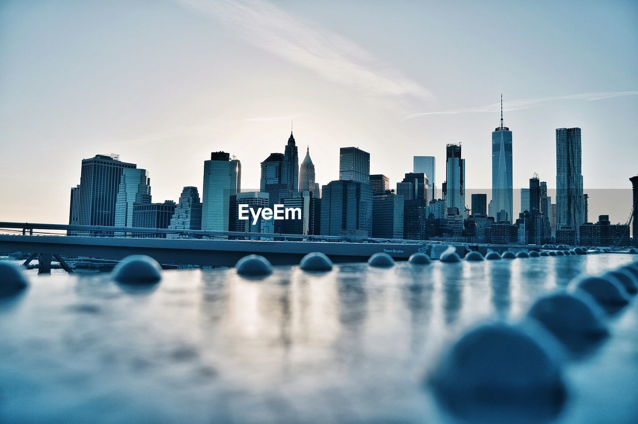 View of city skyline against sky during sunset