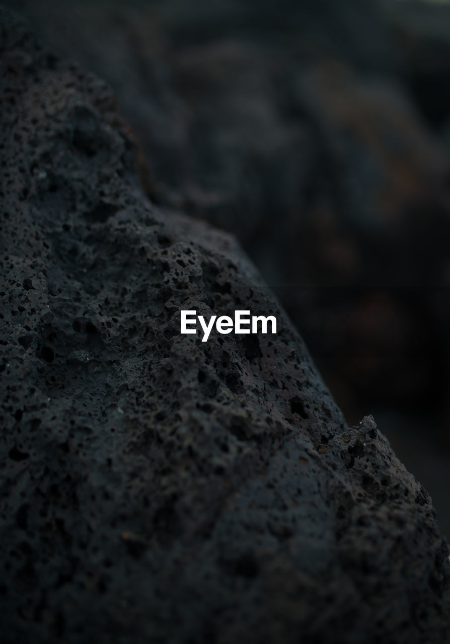 rock, soil, close-up, darkness, black, no people, textured, macro photography, nature, selective focus, volcanic rock, outdoors, rough, day, geology, focus on foreground, land, monochrome