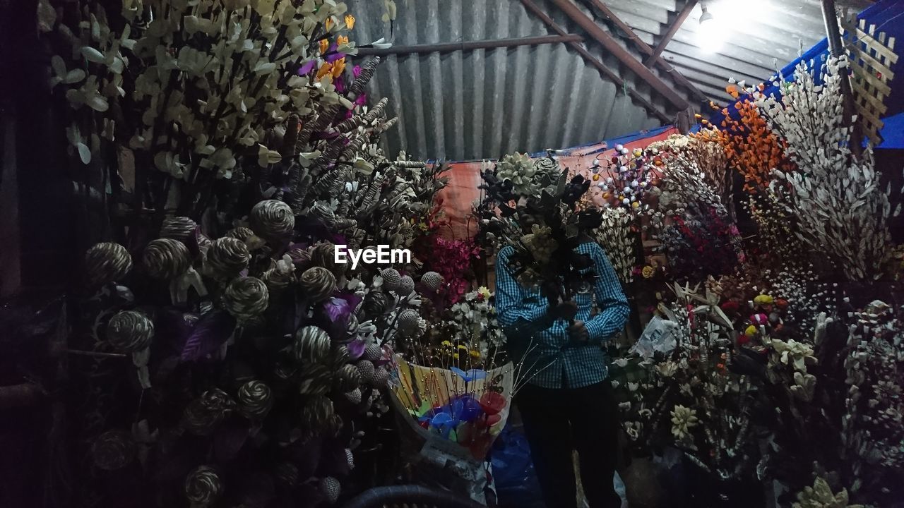 LOW ANGLE VIEW OF FLOWERS IN SHOP