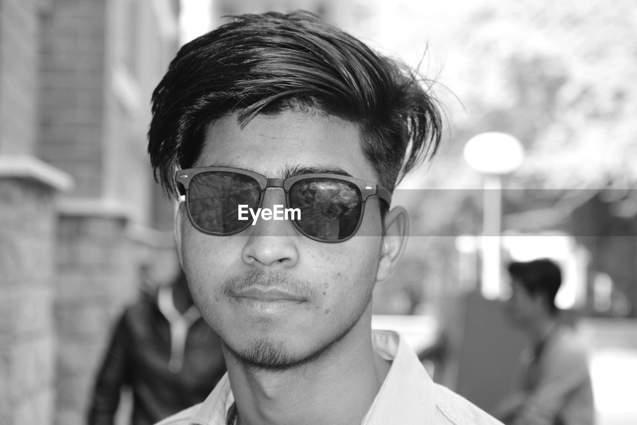 Portrait of young man wearing sunglasses