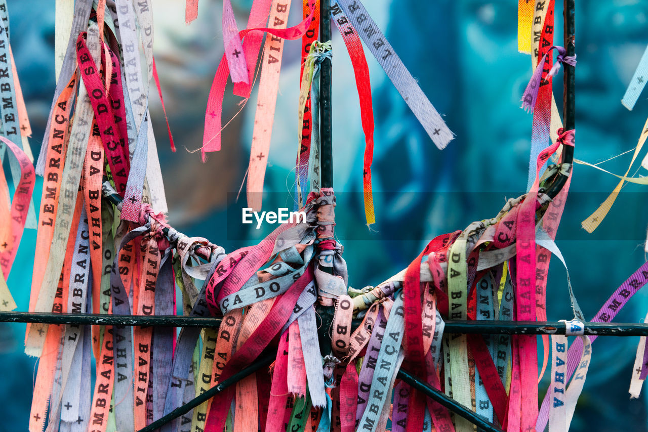 Colored ribbons of senhor do bonfim tied to an iron gate in pelourinho.