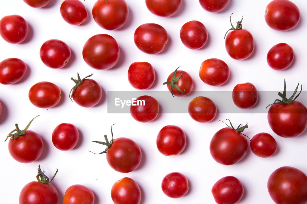 Close-up of cherry tomatoes against white background