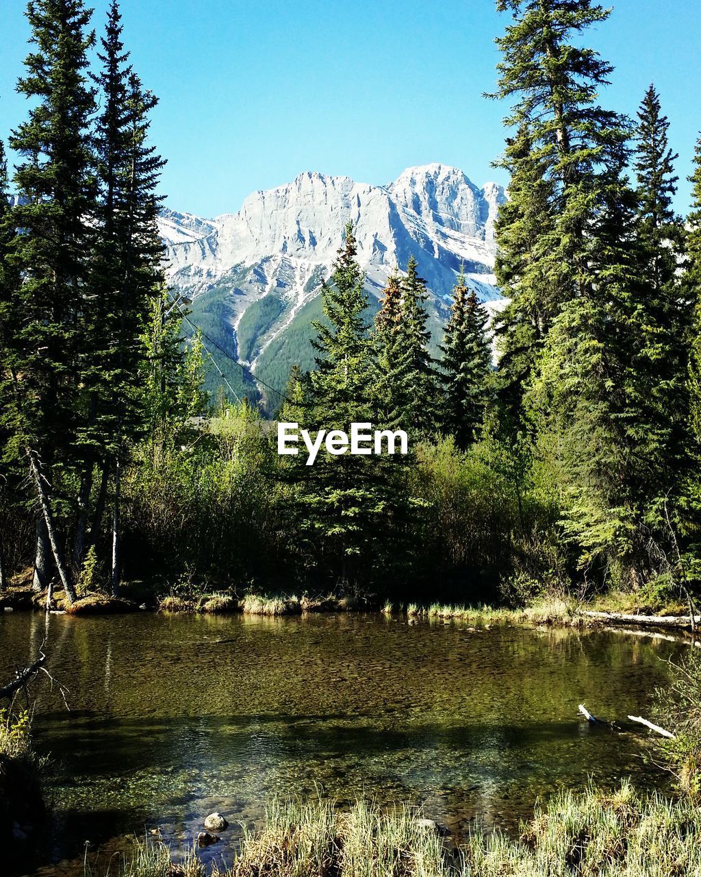 Scenic view of lake with mountains in background