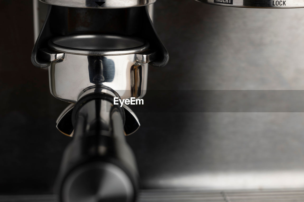 A closeup shot of an espresso coffee machine
