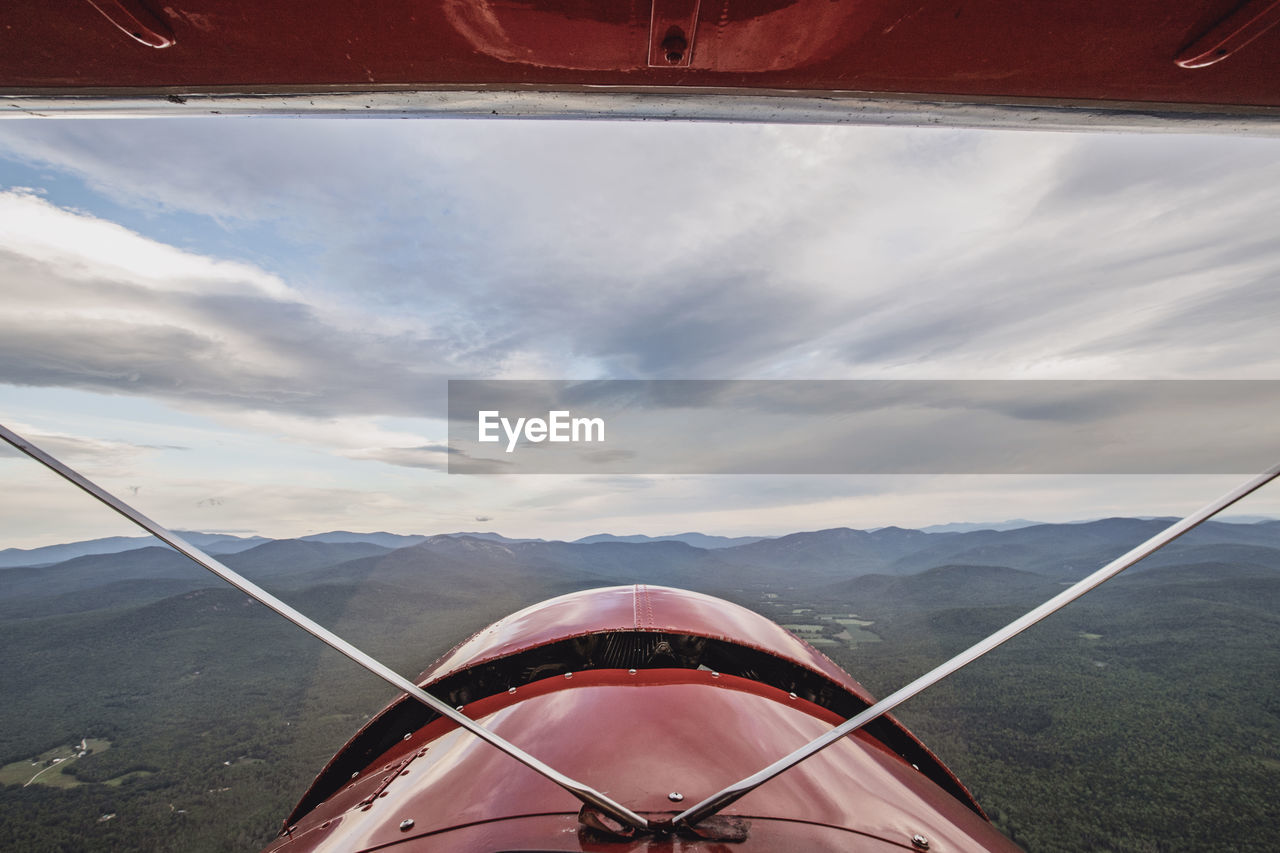 View from cockpit of vintage biplane of white mountains, new hampshire