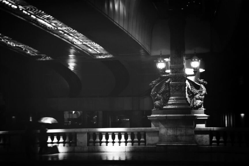 Night view of dragon statues below overpass metropolitan expressway