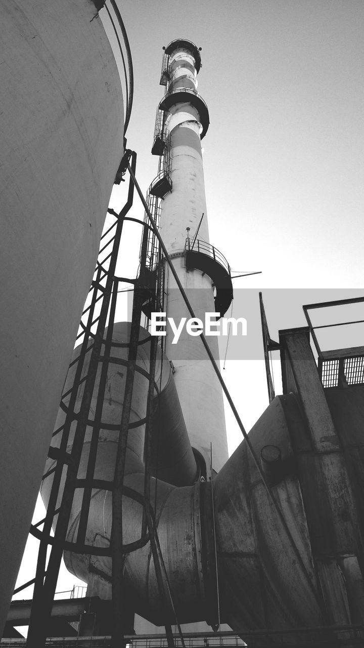 Low angle view of water tower against clear sky