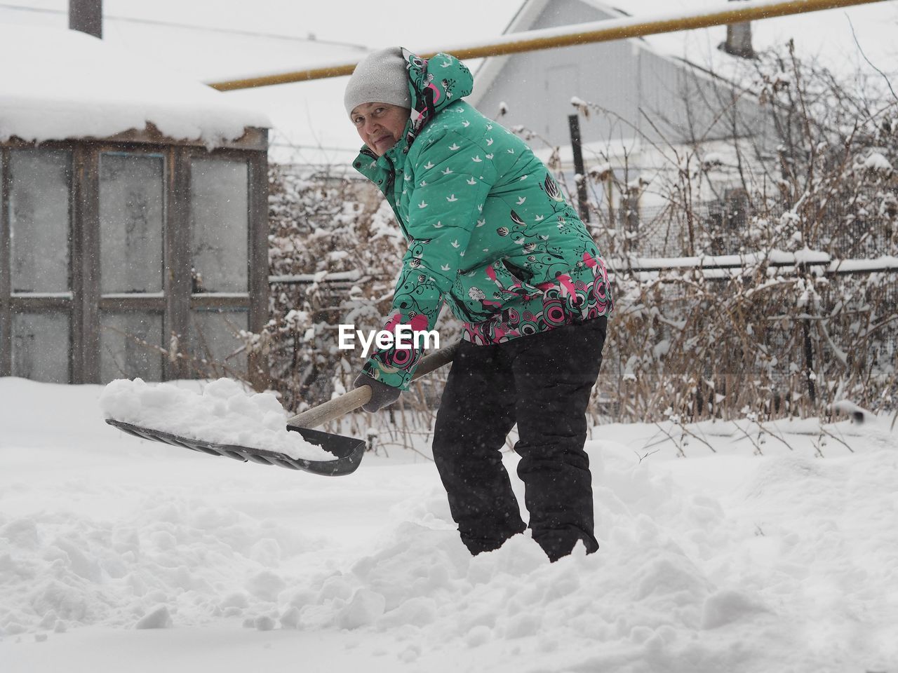 low section of man working on snow